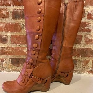 Knee high button boots.